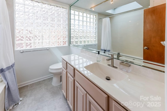 bathroom featuring tile patterned floors, a shower with curtain, toilet, and vanity