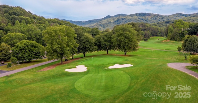 view of home's community featuring golf course view and a mountain view