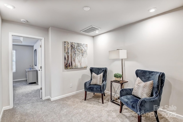 living area featuring recessed lighting, baseboards, visible vents, and carpet floors