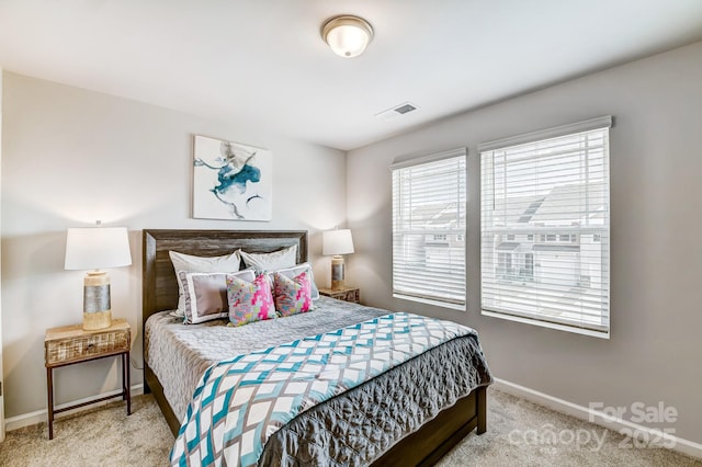 bedroom featuring visible vents, carpet, and baseboards