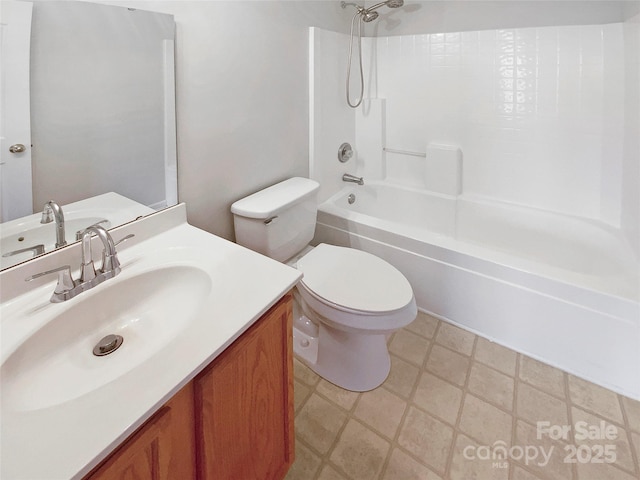 bathroom with vanity, toilet, and shower / washtub combination