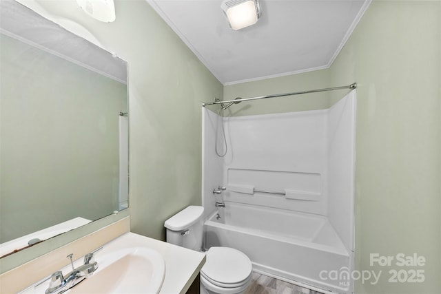 bathroom featuring vanity, wood finished floors, shower / bath combination, crown molding, and toilet