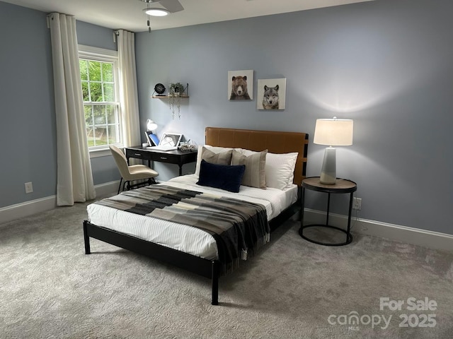 bedroom with carpet flooring and baseboards