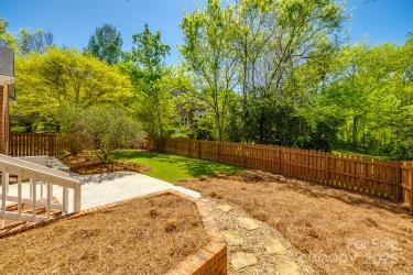 view of yard featuring a patio and a fenced backyard