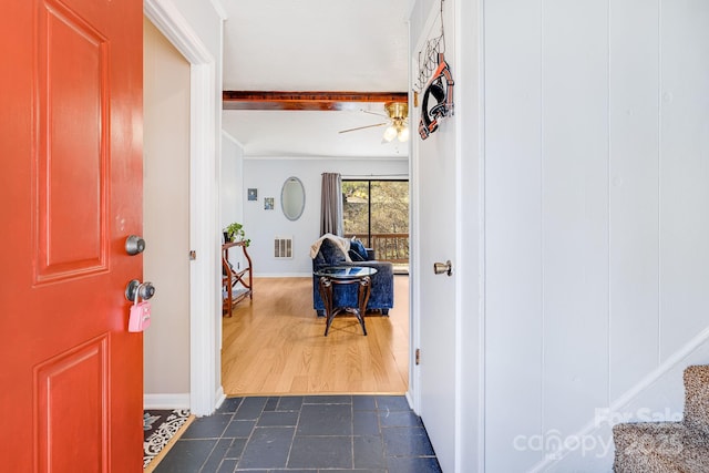 foyer with dark wood-style floors, baseboards, visible vents, and ceiling fan