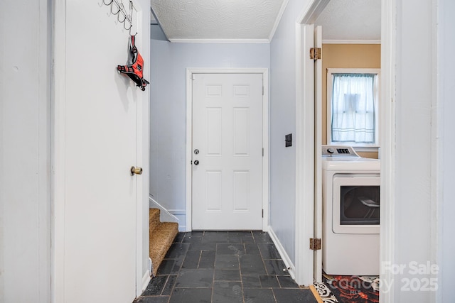 washroom with washer / clothes dryer, a textured ceiling, laundry area, and stone finish floor