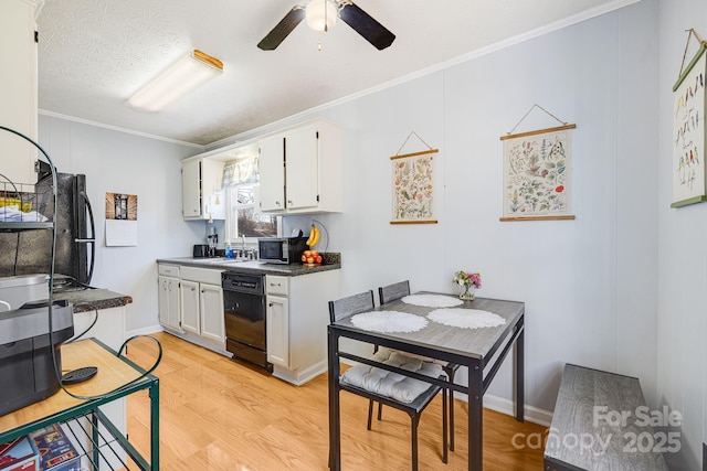 kitchen featuring light wood-type flooring, ornamental molding, a ceiling fan, stainless steel microwave, and dishwasher