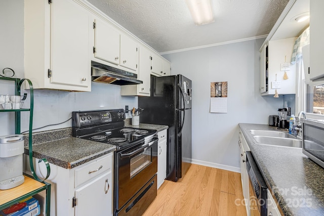 kitchen featuring light wood-style flooring, under cabinet range hood, a sink, black range with electric cooktop, and white cabinetry