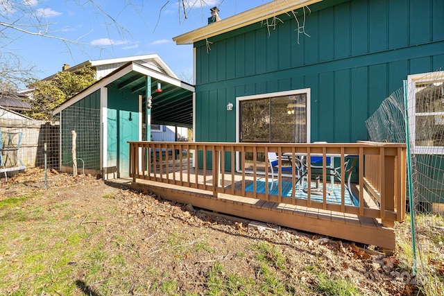 back of property featuring a wooden deck