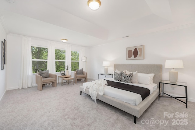 bedroom with carpet floors, crown molding, and baseboards
