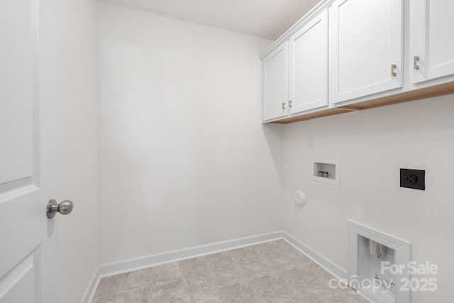 washroom featuring baseboards, gas dryer hookup, hookup for a washing machine, cabinet space, and electric dryer hookup