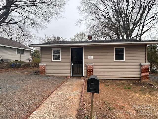 view of front of house with a chimney