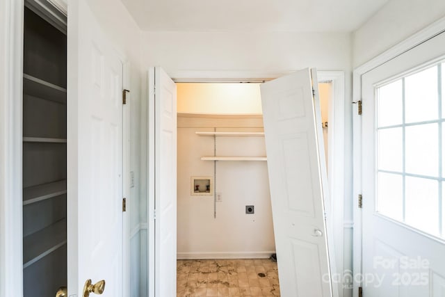 clothes washing area featuring hookup for a washing machine, baseboards, hookup for an electric dryer, and laundry area