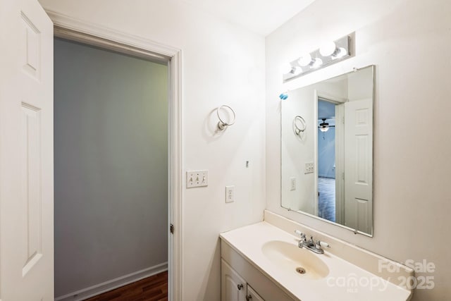 bathroom featuring vanity and baseboards