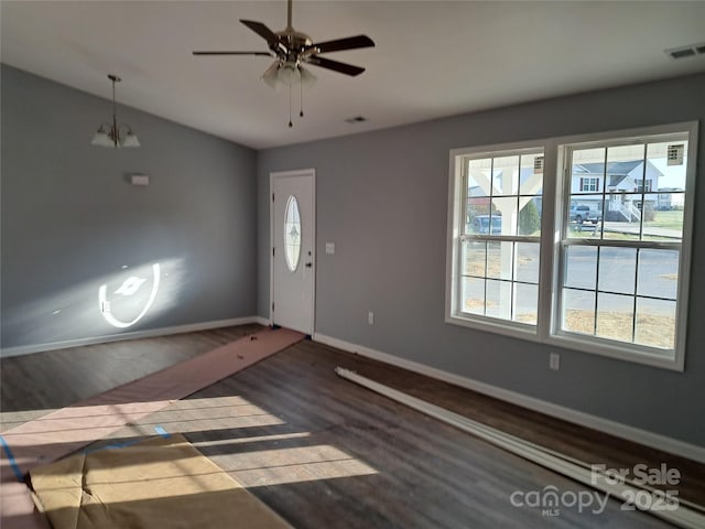 entrance foyer featuring visible vents, ceiling fan, baseboards, and wood finished floors