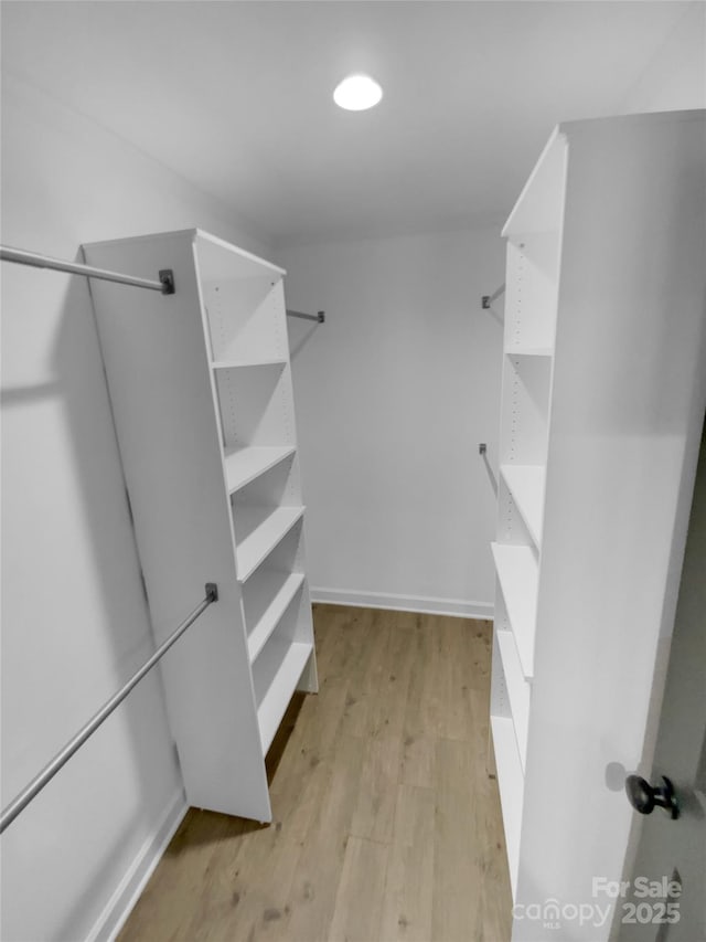 walk in closet featuring light wood-type flooring