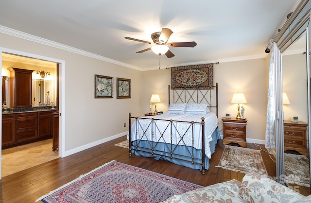 bedroom featuring ensuite bathroom, baseboards, wood-type flooring, and ornamental molding