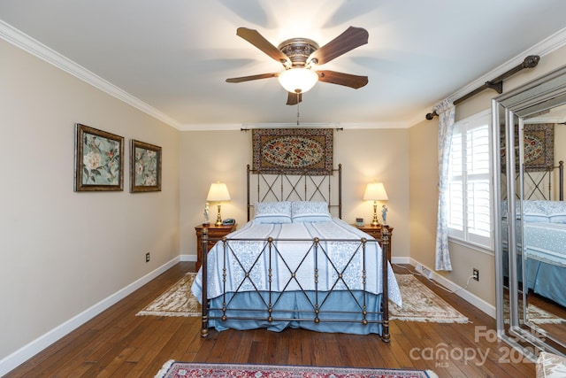 bedroom featuring baseboards, hardwood / wood-style floors, and crown molding