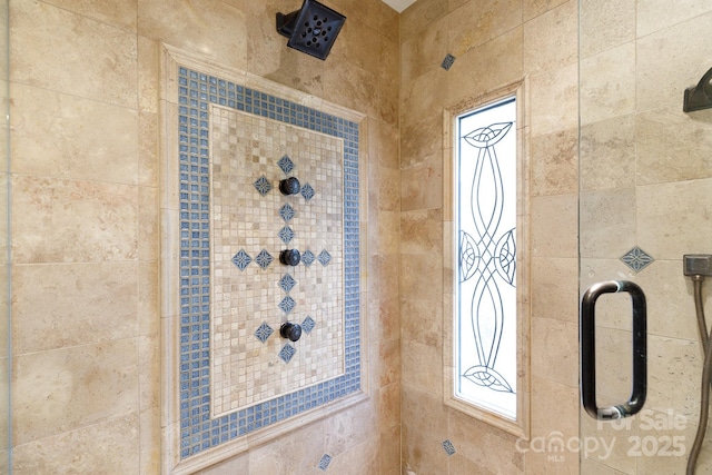 interior details featuring tiled shower