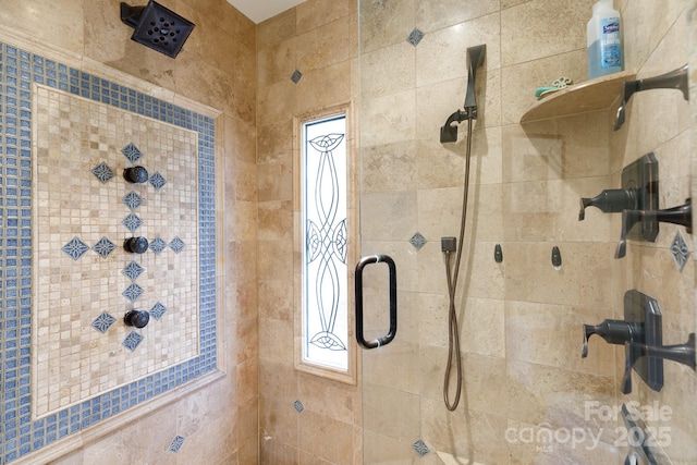 bathroom with a tile shower