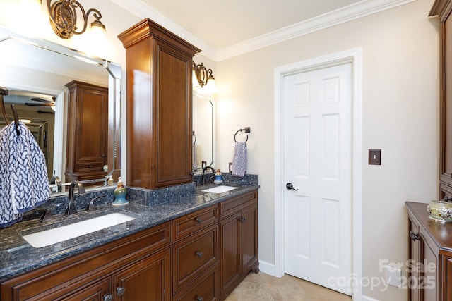 full bath with tile patterned flooring, double vanity, ornamental molding, and a sink