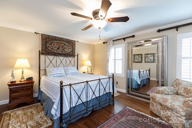 bedroom featuring ceiling fan, baseboards, ornamental molding, and hardwood / wood-style flooring