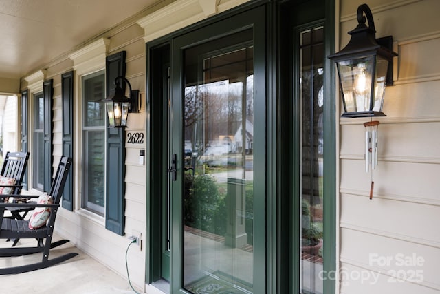 entrance to property featuring a porch