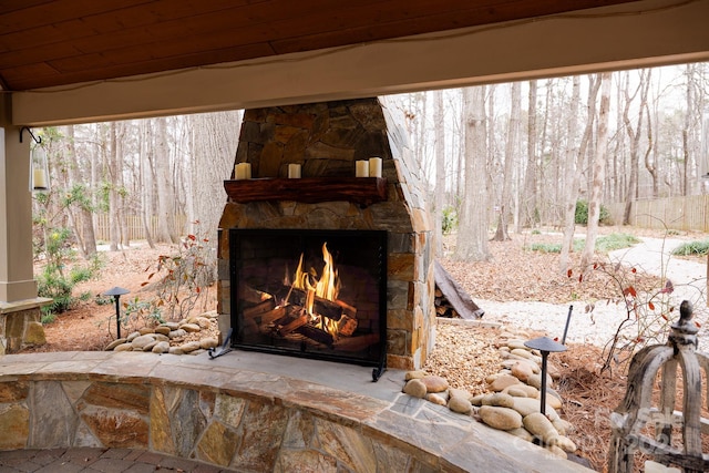 exterior details featuring an outdoor stone fireplace