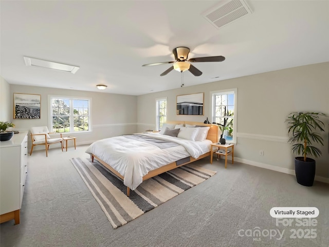 bedroom featuring baseboards, visible vents, attic access, and carpet