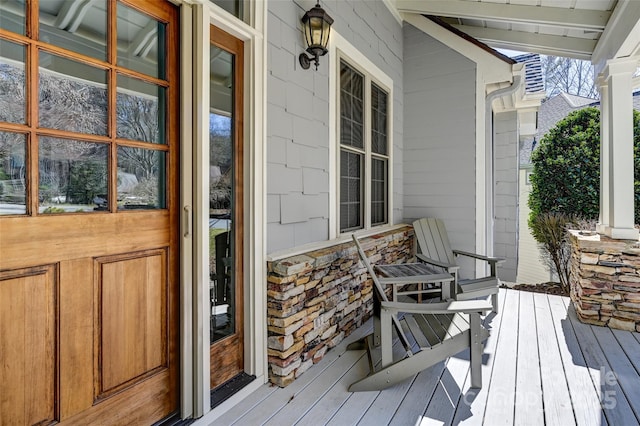 wooden terrace featuring a porch