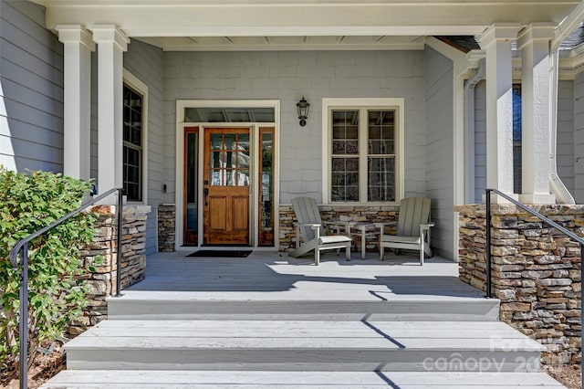 doorway to property featuring a porch