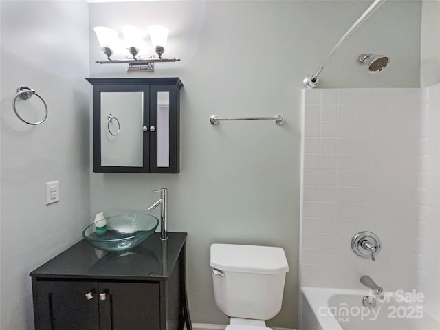 bathroom with toilet, bathtub / shower combination, and vanity