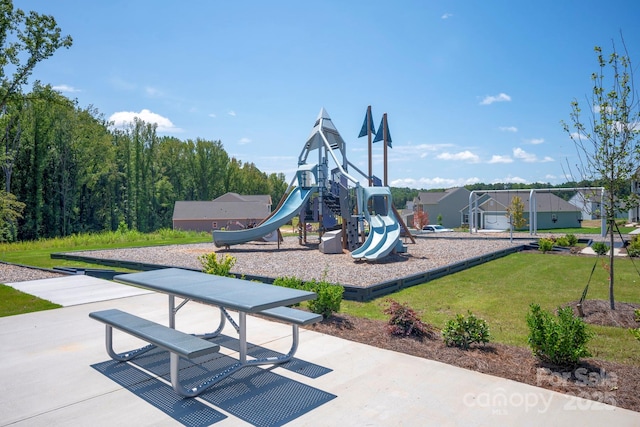 community play area featuring a lawn