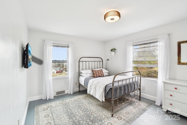 bedroom featuring visible vents and baseboards