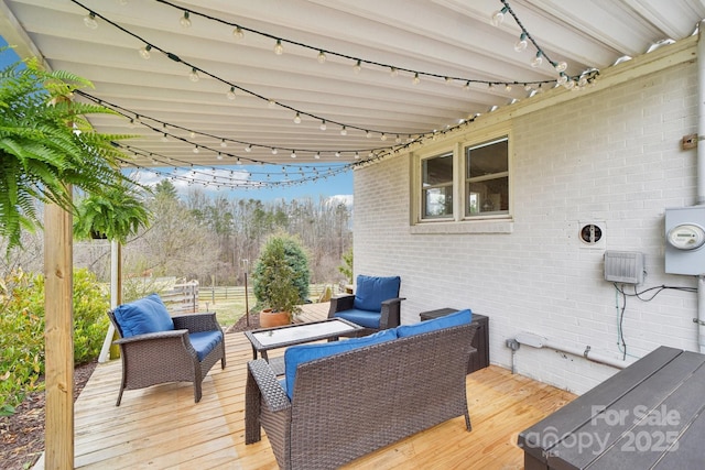 deck with outdoor lounge area and fence