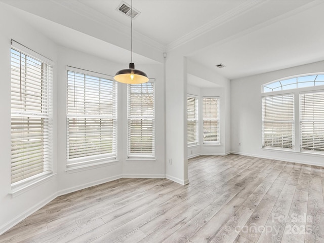 unfurnished dining area featuring visible vents, baseboards, and light wood finished floors