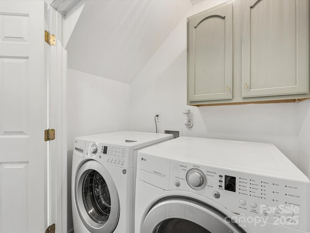 laundry room with cabinet space and washing machine and clothes dryer