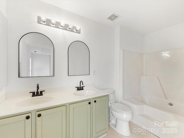 full bathroom with a sink, visible vents, toilet, and double vanity