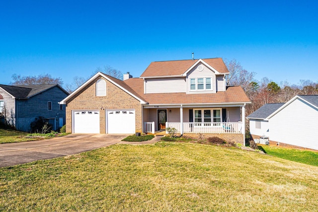 traditional home featuring a front lawn, covered porch, a chimney, a garage, and driveway