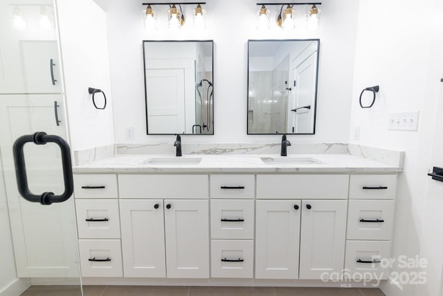 bathroom with a sink and double vanity