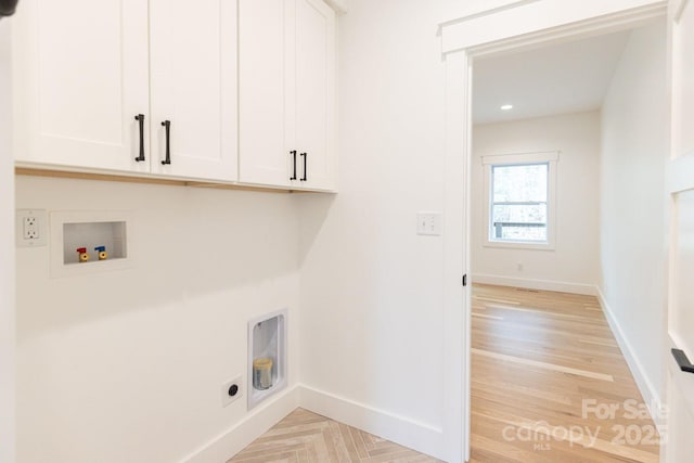 laundry room featuring baseboards, washer hookup, cabinet space, hookup for an electric dryer, and parquet floors