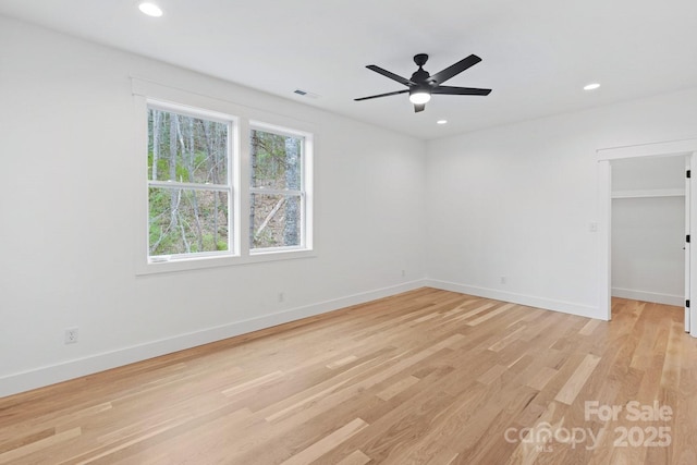 empty room with recessed lighting, visible vents, baseboards, and light wood-style floors