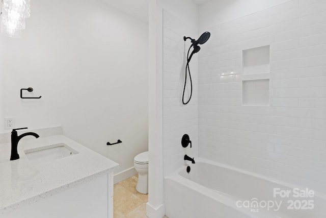 bathroom featuring baseboards, toilet, vanity, and  shower combination