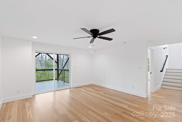 unfurnished room with light wood finished floors, ceiling fan, baseboards, stairway, and recessed lighting