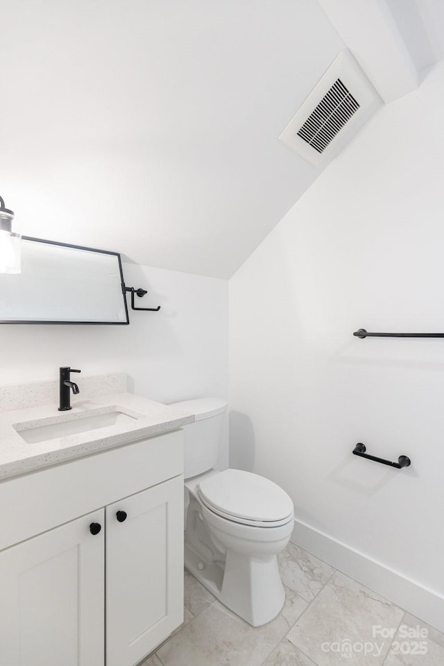 half bath with vanity, visible vents, baseboards, toilet, and marble finish floor