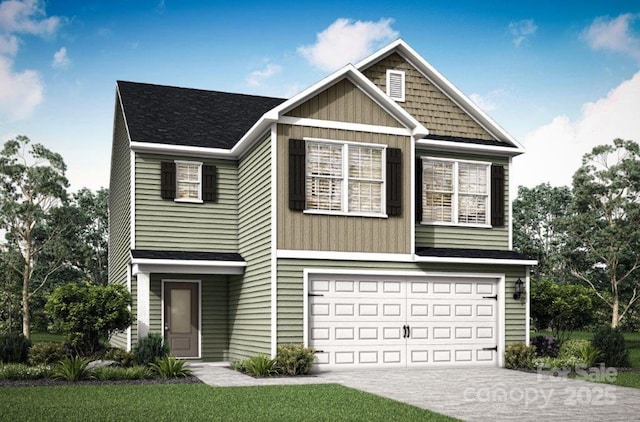 view of front of property with concrete driveway and a garage