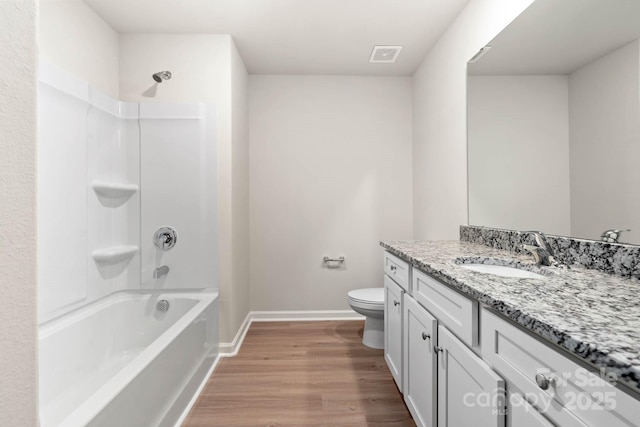 full bathroom featuring visible vents, toilet, wood finished floors, baseboards, and vanity