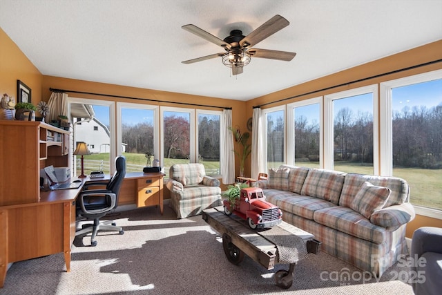 sunroom / solarium with a ceiling fan