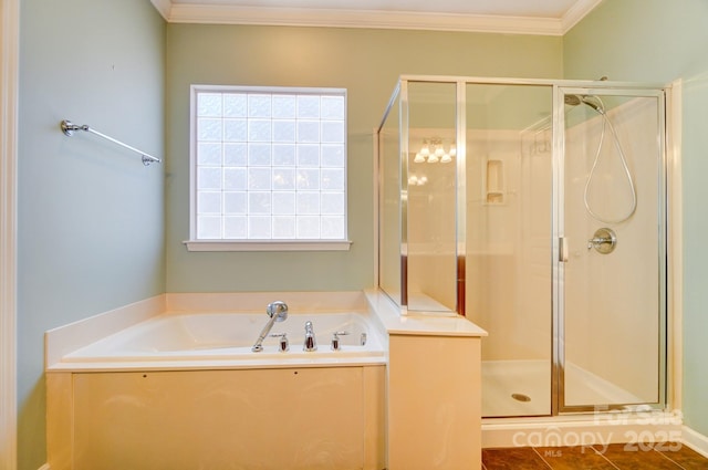 bathroom with a bath, tile patterned flooring, a stall shower, and crown molding