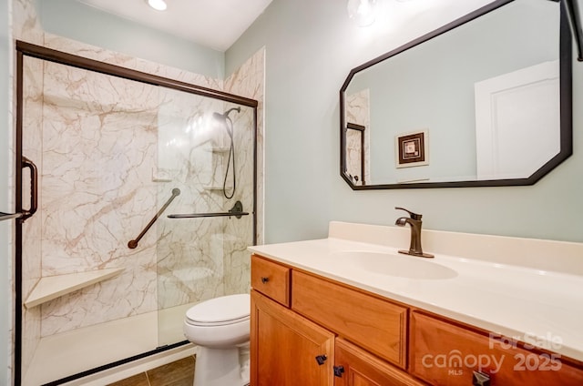 bathroom featuring vanity, toilet, and a marble finish shower